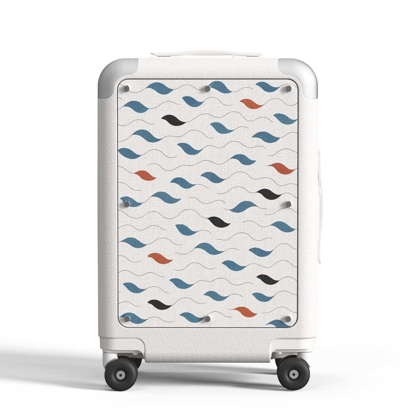 Designer carry-on luggage in white with Tideform pattern panel featuring modern blue, black, and orange wave design