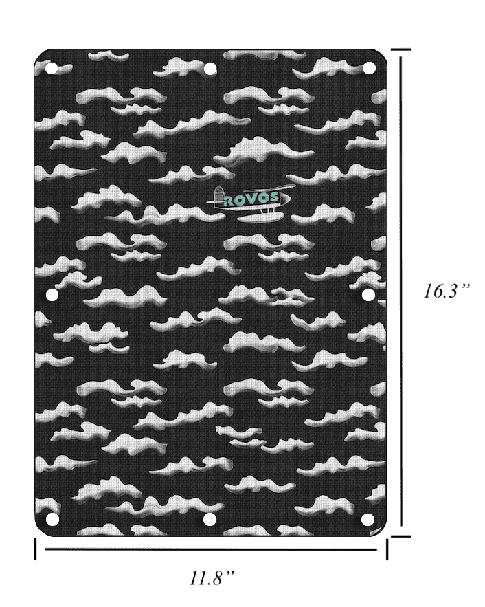 Interchangeable black canvas panel for designer carry-on luggage displayed in minimal setting